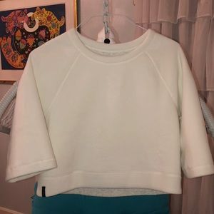 Reversible cropped sweater from New Balance.